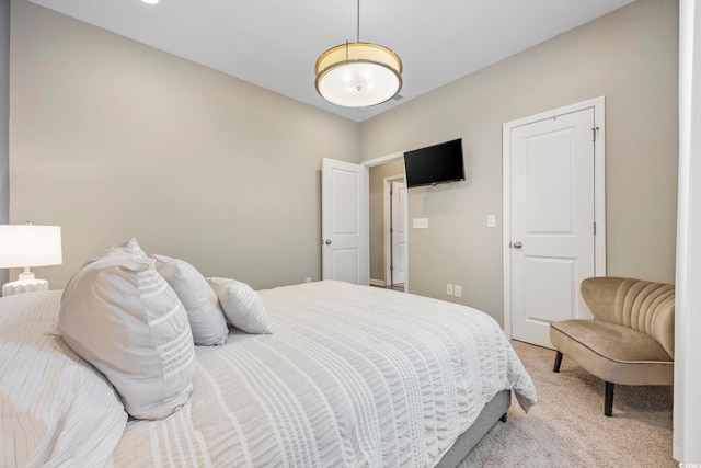 bedroom featuring light colored carpet