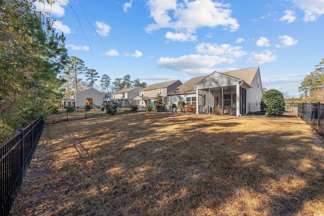 view of yard with a sunroom