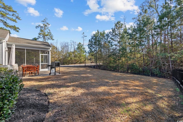 view of yard with a sunroom