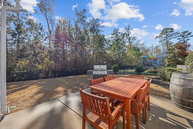 view of patio / terrace with a playground and grilling area