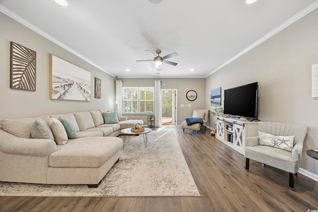 living room with hardwood / wood-style flooring, ceiling fan, and ornamental molding