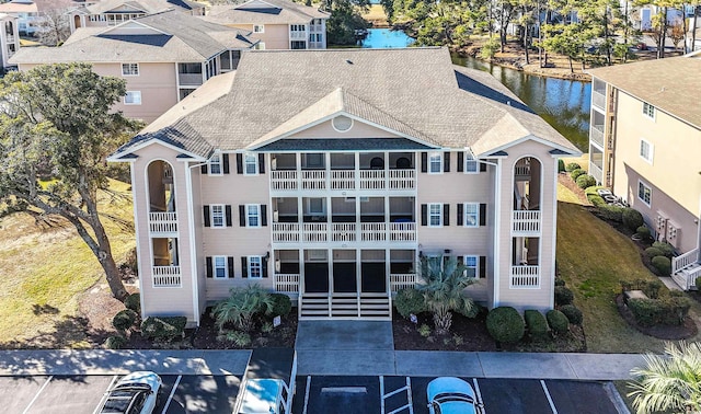 view of building exterior featuring a water view