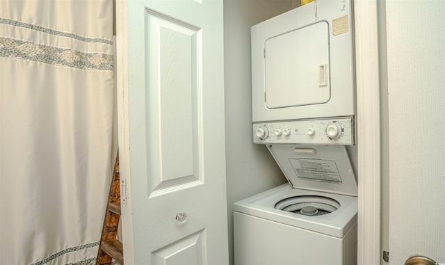 laundry area with stacked washer and clothes dryer