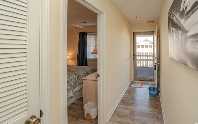 doorway to outside with light wood-type flooring