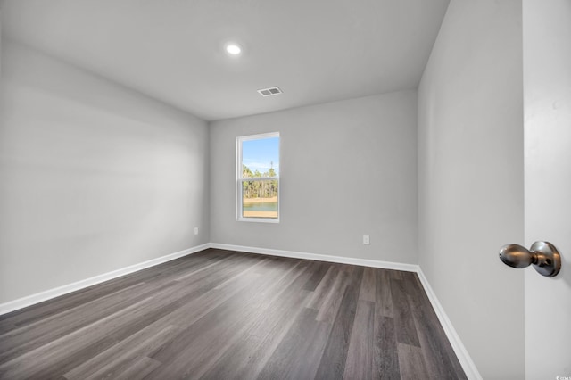 empty room featuring dark hardwood / wood-style floors