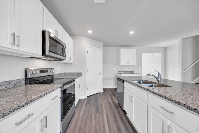 kitchen featuring white cabinets, appliances with stainless steel finishes, and sink