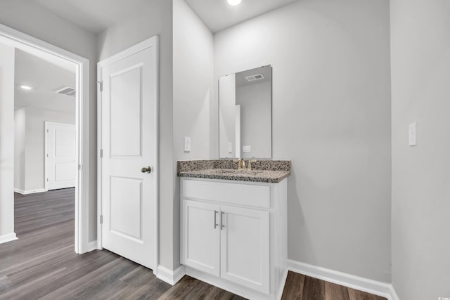 bathroom featuring hardwood / wood-style floors and vanity