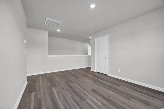 spare room featuring dark hardwood / wood-style flooring