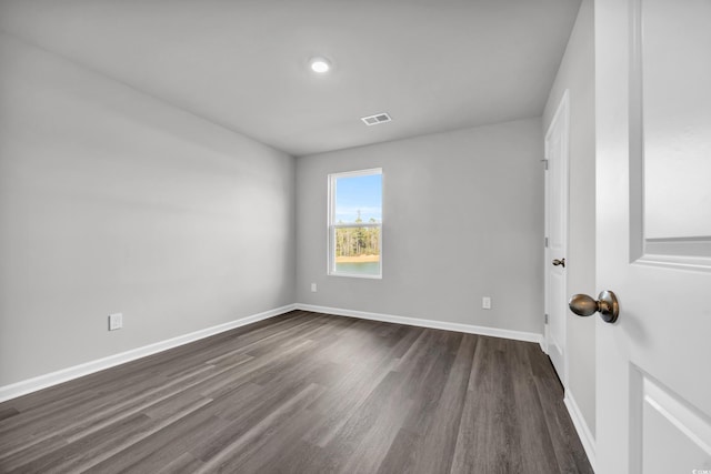 unfurnished room with dark hardwood / wood-style floors