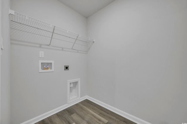 clothes washing area featuring electric dryer hookup, dark wood-type flooring, and washer hookup