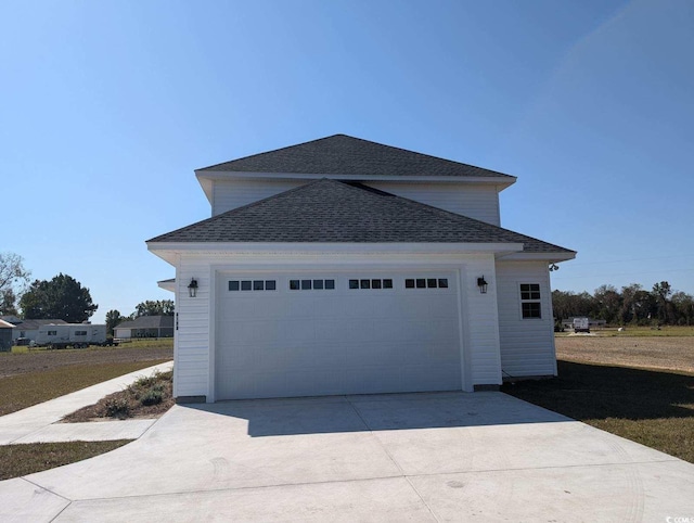 view of side of home with a garage