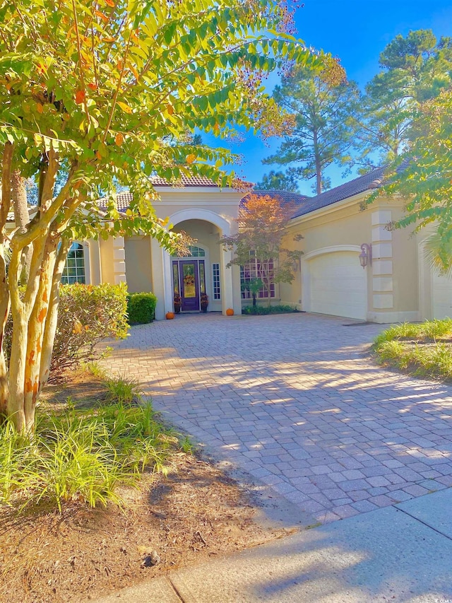 view of front of property with a garage