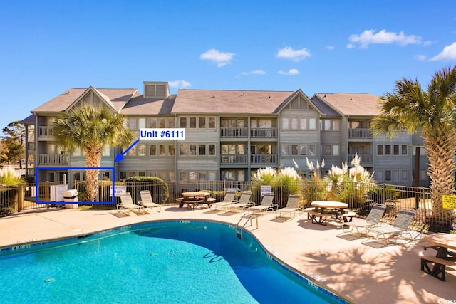 view of pool featuring a patio