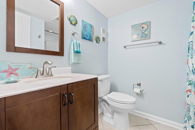 bathroom featuring tile patterned floors, vanity, and toilet