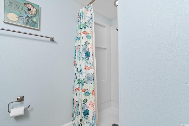 bathroom featuring walk in shower