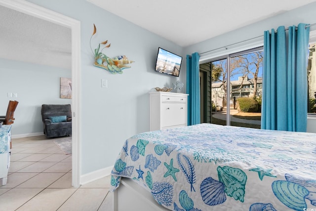 tiled bedroom featuring access to exterior