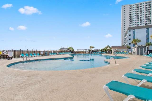 view of pool featuring a patio area