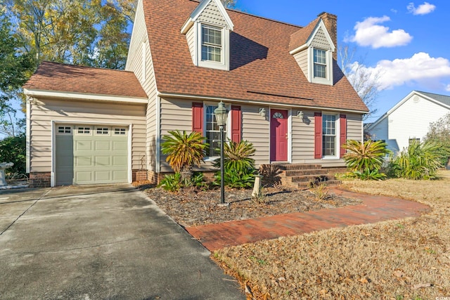 702 Plantation Dr, Surfside Beach, SC 29575 - view of front of property featuring a garage, concrete driveway, roof with shingles, and a chimney