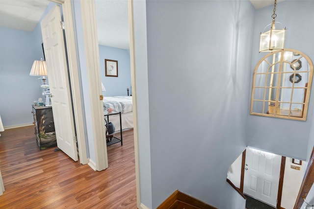 702 Plantation Dr, Surfside Beach, SC 29575 - corridor featuring wood finished floors and baseboards