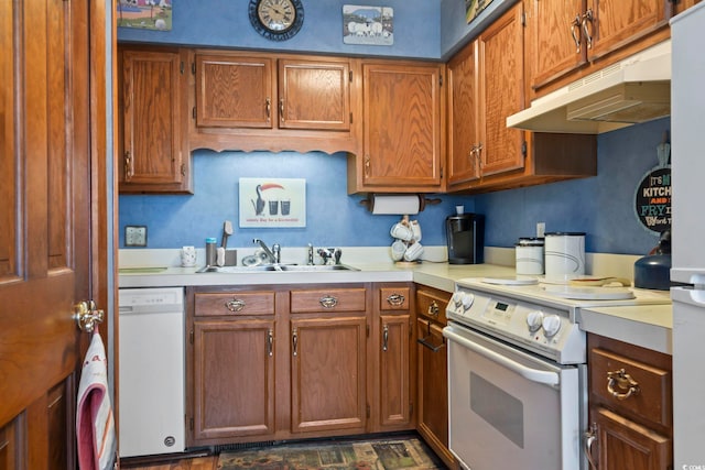 702 Plantation Dr, Surfside Beach, SC 29575 - kitchen featuring white appliances, a sink, under cabinet range hood, and light countertops