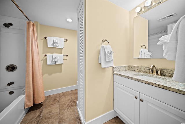 bathroom featuring vanity and shower / bath combination with curtain