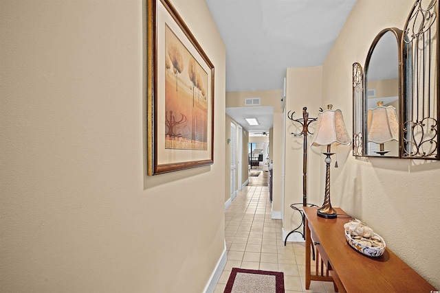 corridor featuring light tile patterned floors