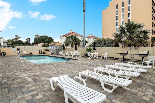 view of pool featuring a patio