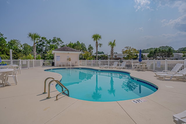 view of pool featuring a patio