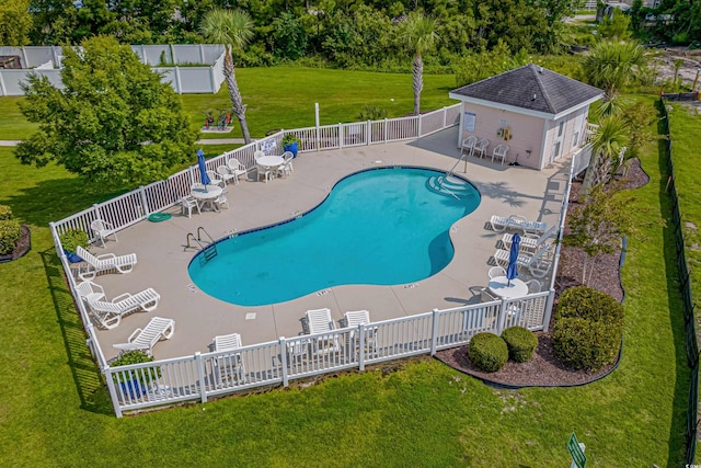 view of swimming pool with a lawn and a patio area