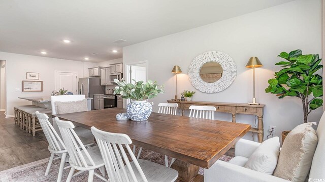 dining room with hardwood / wood-style flooring