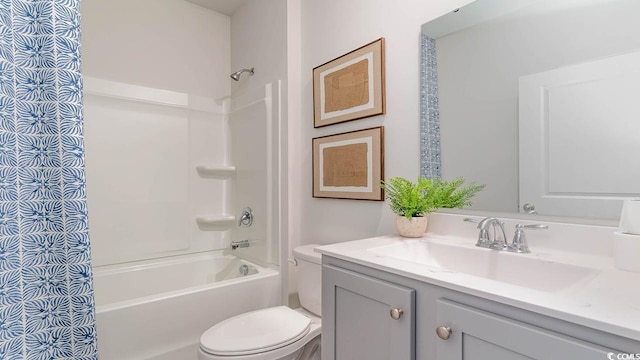 full bathroom with shower / tub combination, vanity, and toilet