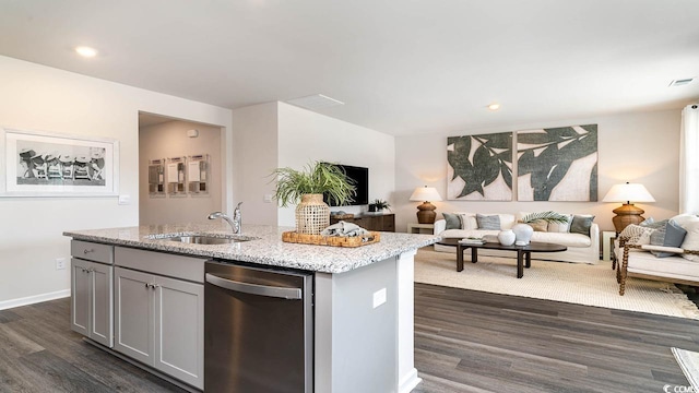 kitchen with gray cabinetry, dishwasher, sink, dark hardwood / wood-style flooring, and a kitchen island with sink