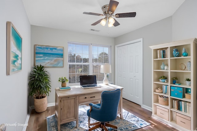 office with hardwood / wood-style floors and ceiling fan