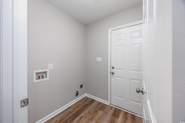 washroom with washer hookup, hardwood / wood-style floors, hookup for an electric dryer, and a textured ceiling