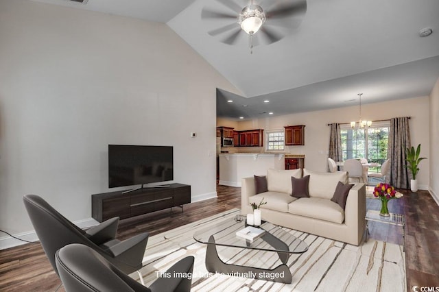 living room with high vaulted ceiling, dark hardwood / wood-style floors, and ceiling fan with notable chandelier