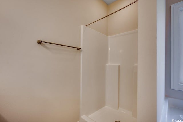 bathroom featuring walk in shower