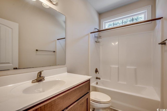 full bathroom featuring vanity, shower / washtub combination, and toilet