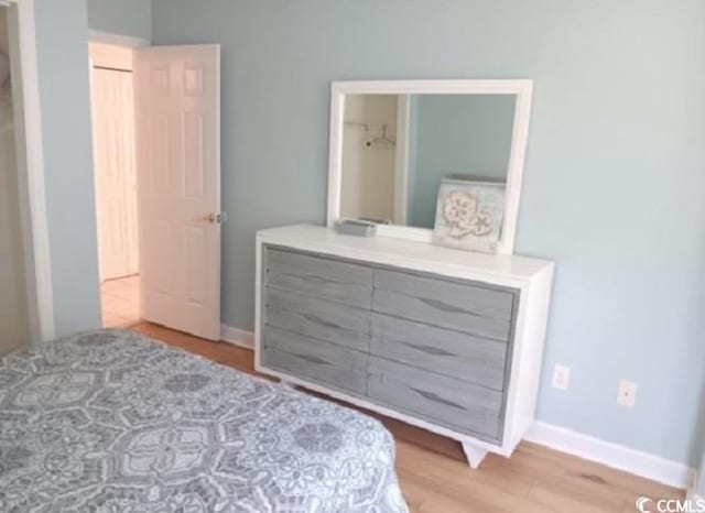 bedroom with hardwood / wood-style floors