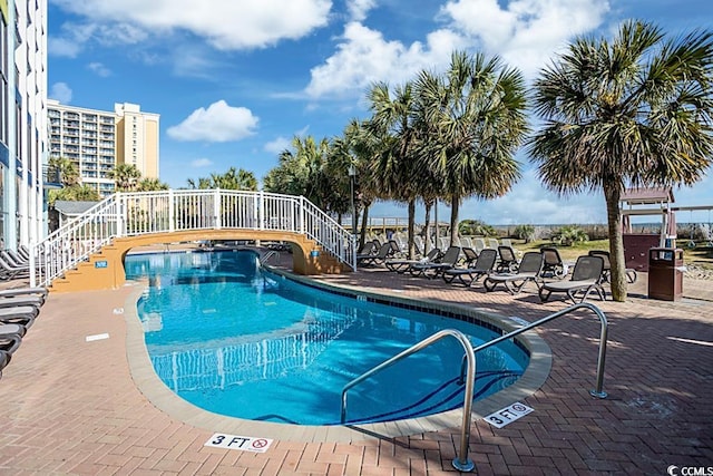 view of swimming pool featuring a patio