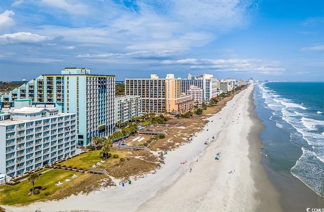 birds eye view of property with a view of the beach and a water view