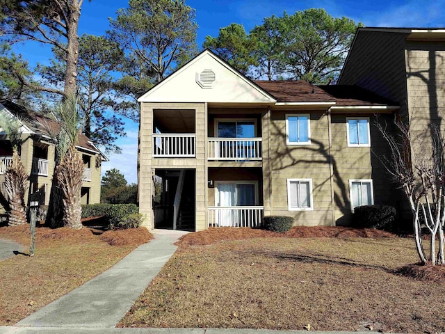 view of front of house with a balcony