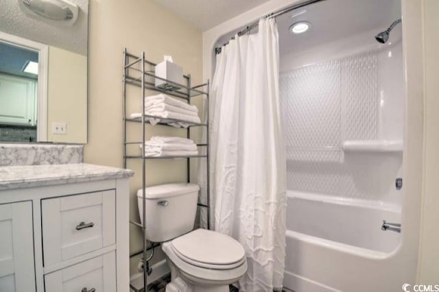 full bathroom featuring vanity, toilet, a textured ceiling, and shower / tub combo with curtain