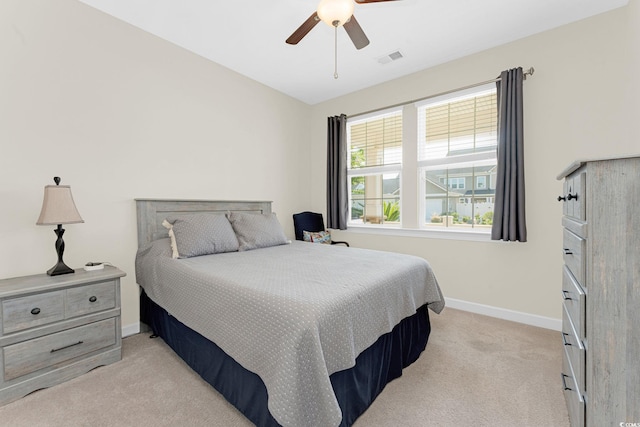 bedroom featuring ceiling fan and light colored carpet