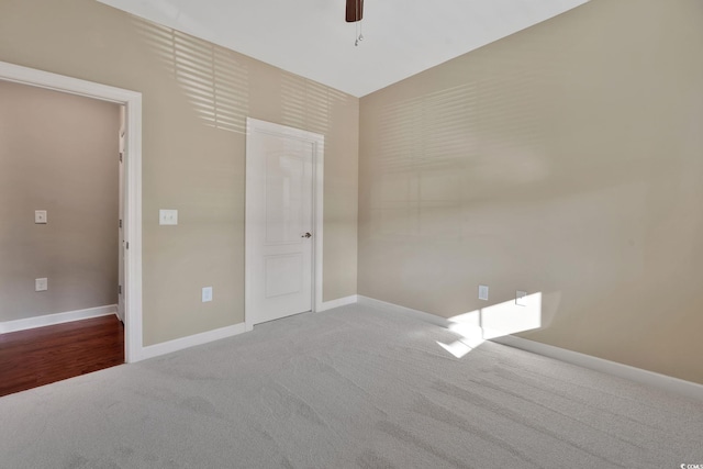 carpeted empty room with ceiling fan