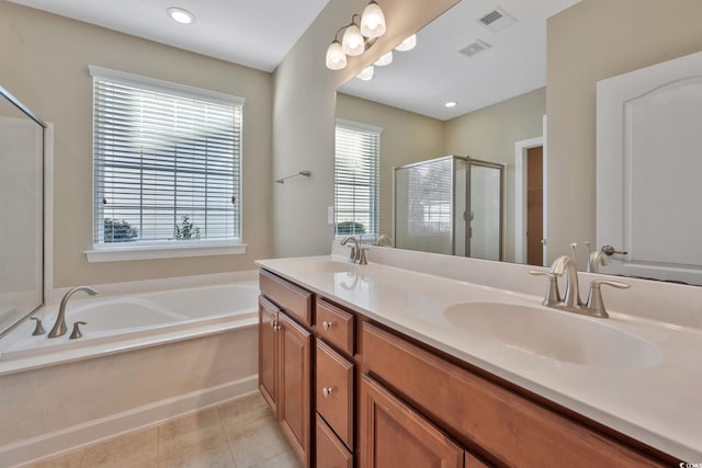 bathroom featuring tile patterned flooring, plenty of natural light, vanity, and plus walk in shower