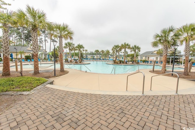 view of swimming pool with a patio