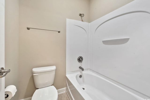 bathroom with tub / shower combination and toilet