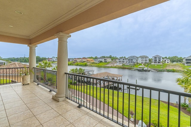 balcony featuring a residential view and a water view