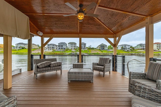 view of dock featuring a gazebo, a residential view, and a water view