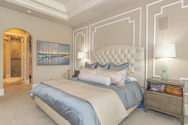 bedroom featuring arched walkways, a tray ceiling, carpet, and ornamental molding